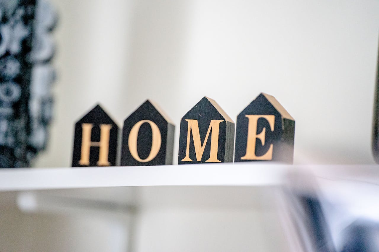 Stylish wooden block letters spelling "HOME" for cozy home decor.