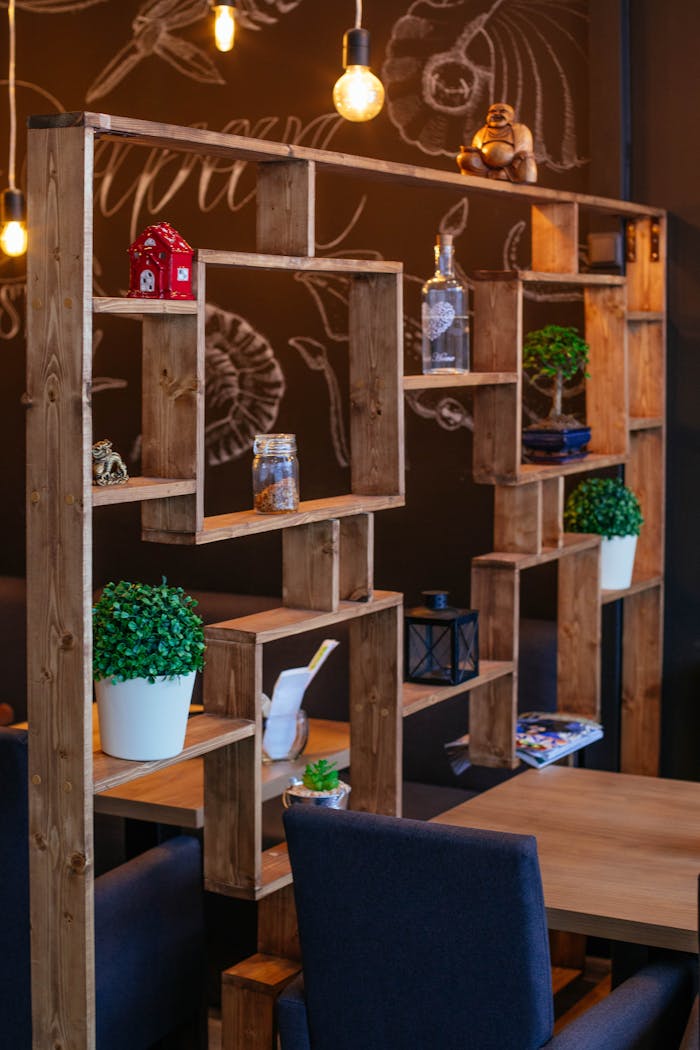 Charming cafe setting featuring wooden shelves, indoor plants, and cozy decor.