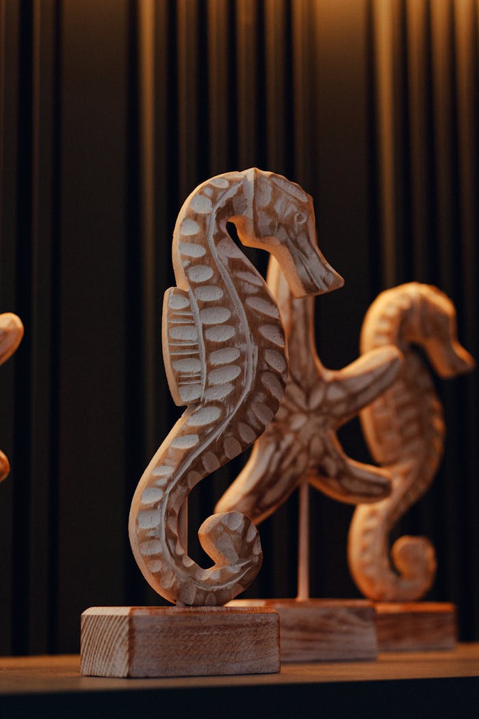 Close-up of detailed wooden seahorse figurines ideal for artistic home decor
